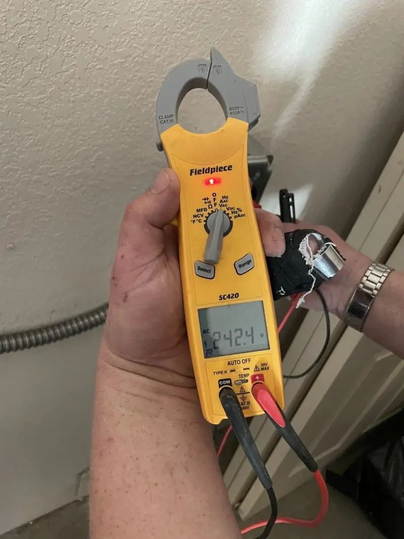 Voltage testing with clamp meter during Hot Tub / Pool Electrical Wiring in Rochester